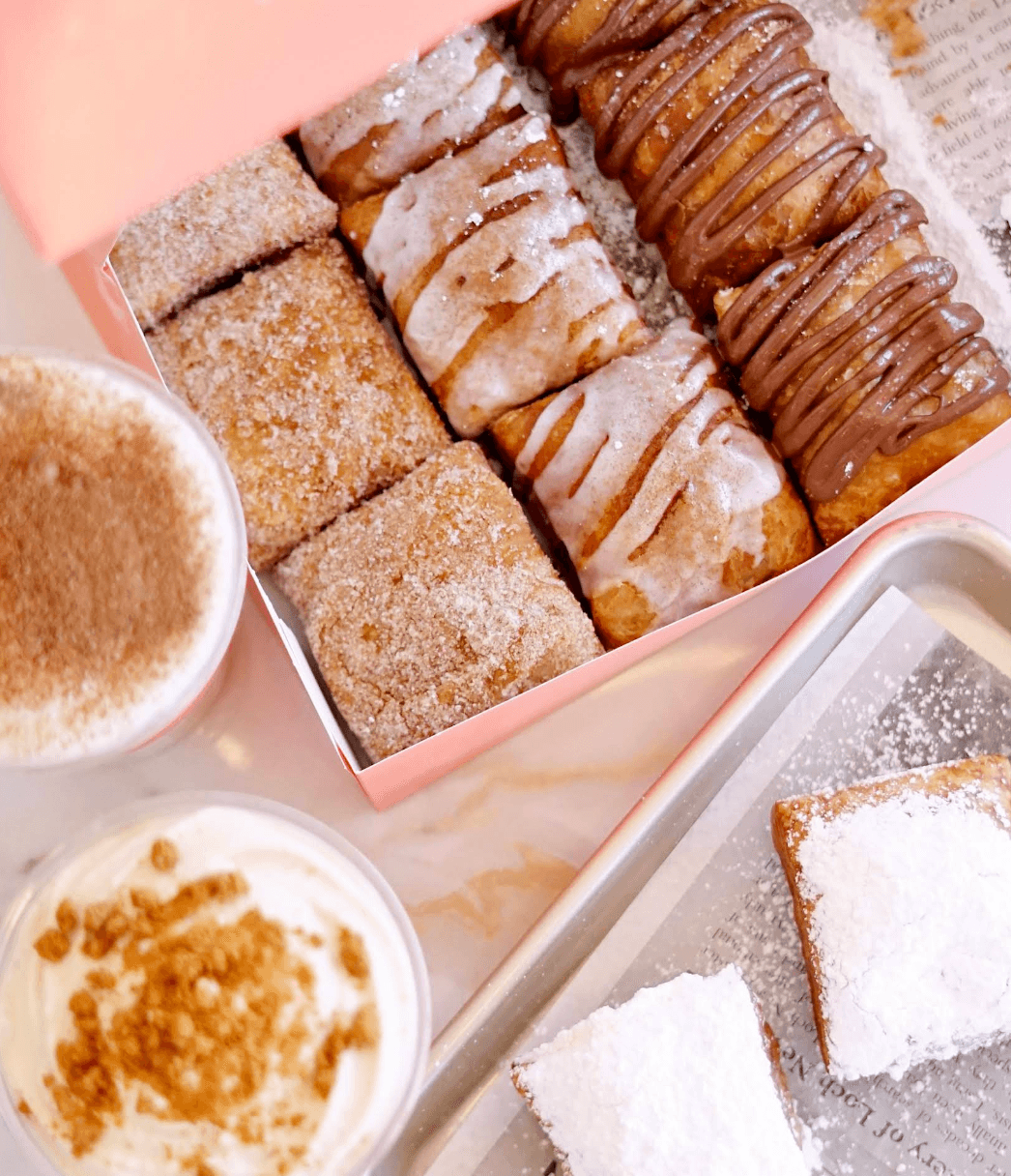 Beignets and coffee on a table